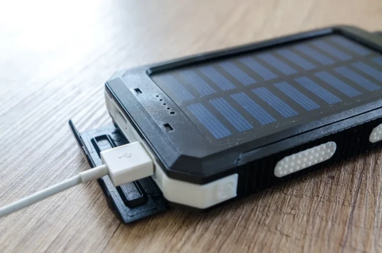 Small solar power bank on a table, representing the compact EcoFlow River 3 Plus power station