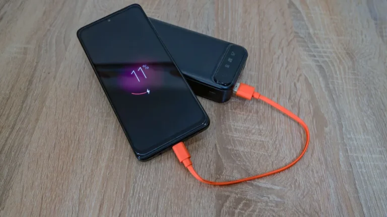 Portable power bank charging a phone, similar to the Goal Zero Yeti 700 use case