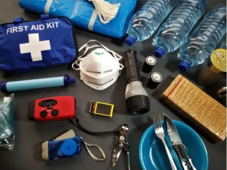 Emergency preparedness kit with first aid, flashlight, water, and radio