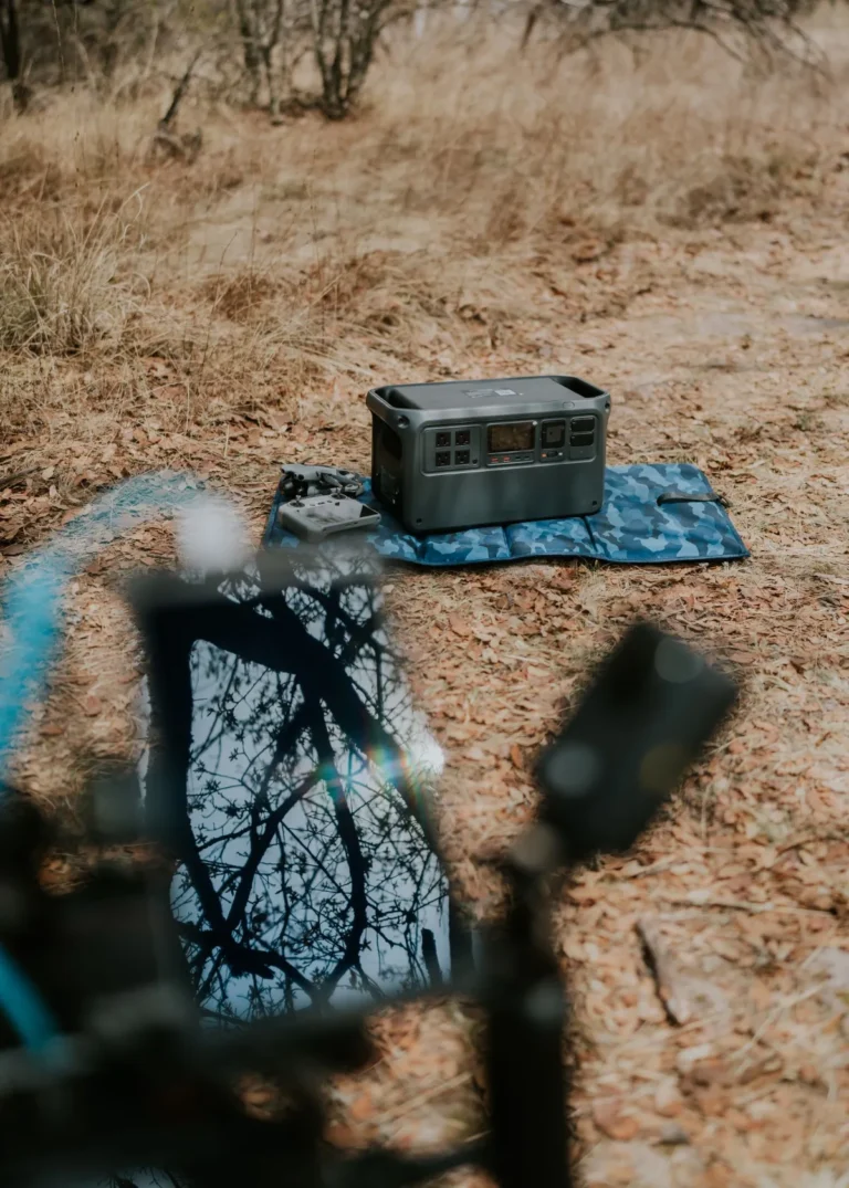 Portable power station in a natural outdoor setting, illustrating expansion battery options