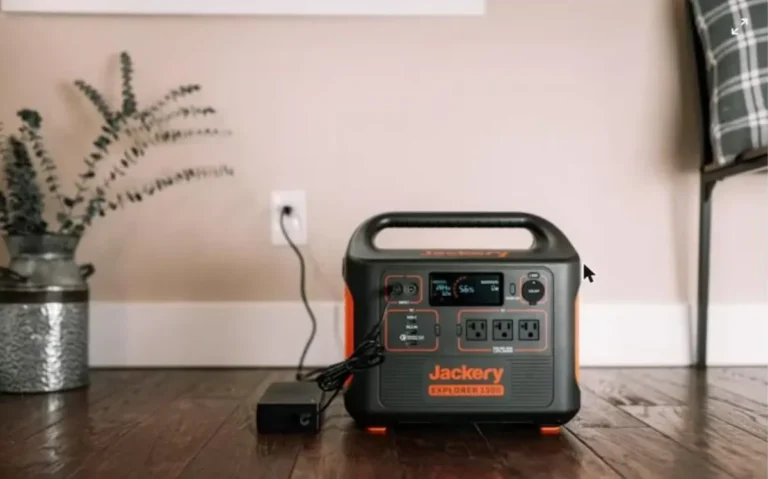 Portable power station with pure sine wave inverter sitting on a wood floor at home